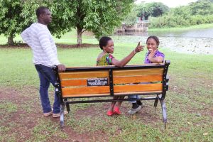 Staff seated on the bench; appreciation to David Sewell and the Retrobeights.